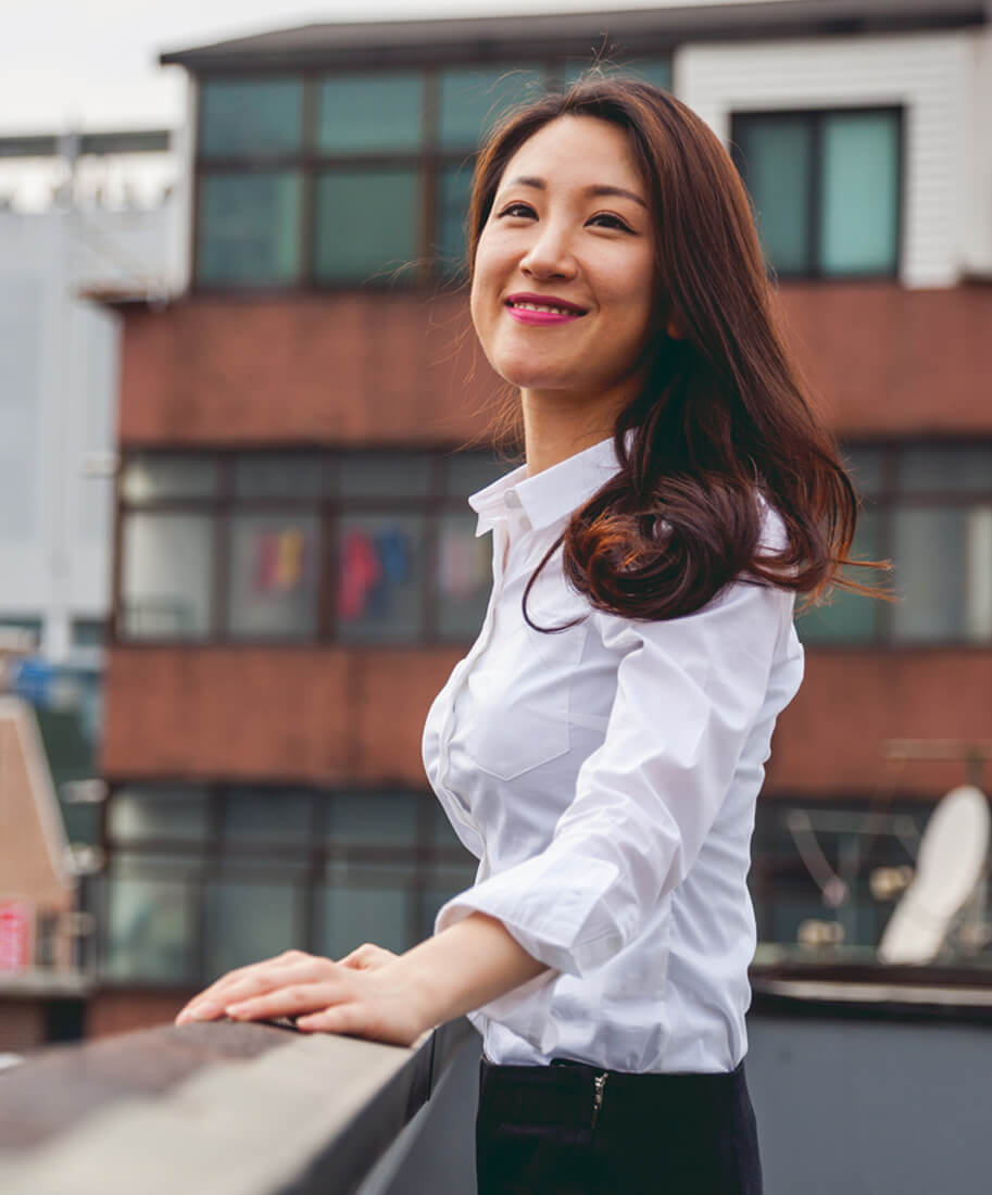 woman leaning against railing